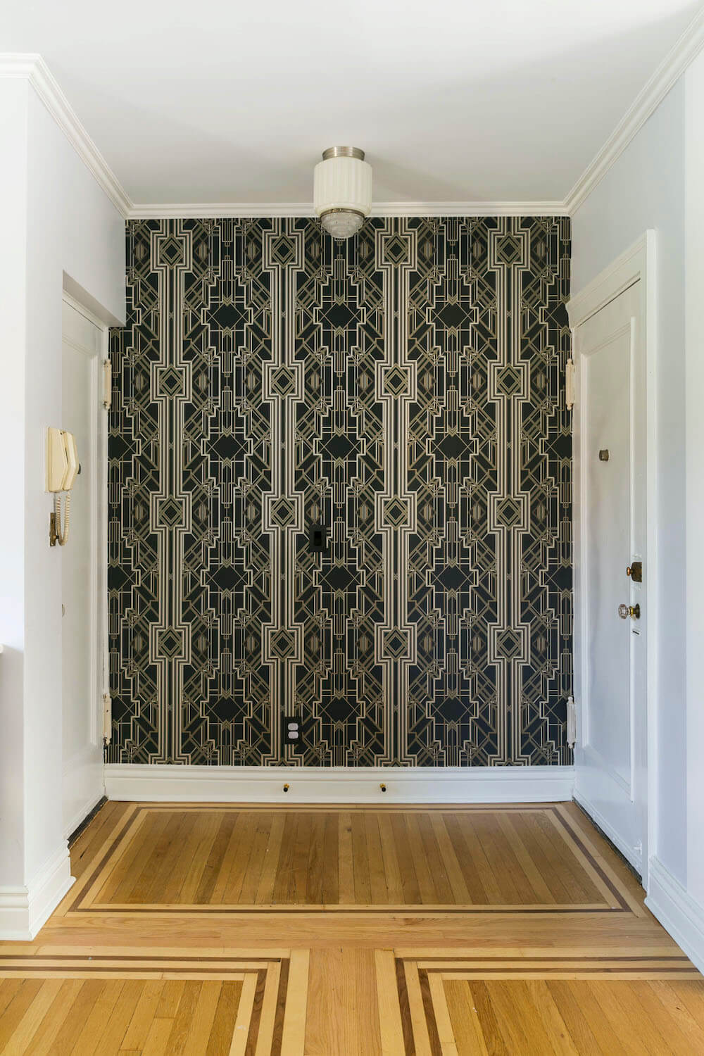 Accent wall at the entryway with graphic wallpaper