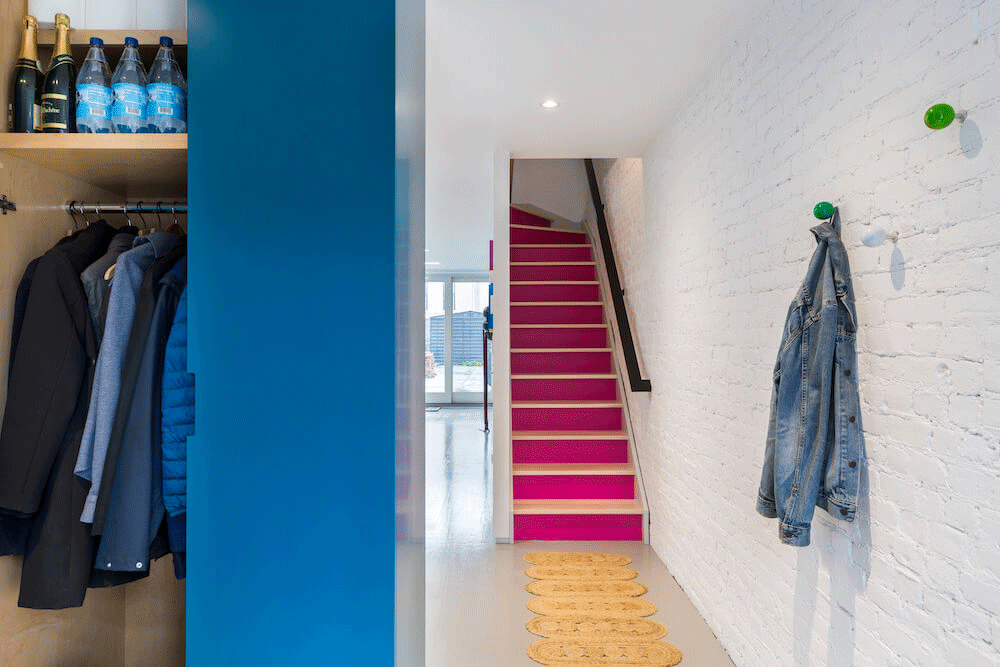 Image of a blue storage unit and pink staircase
