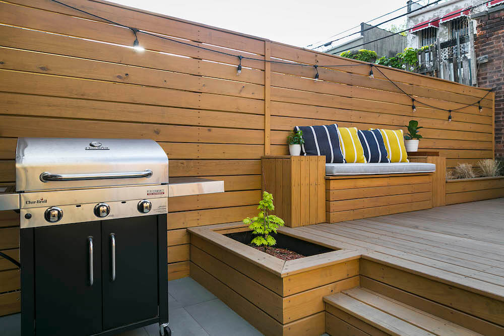 Image of remodeled backyard with grill and seating area