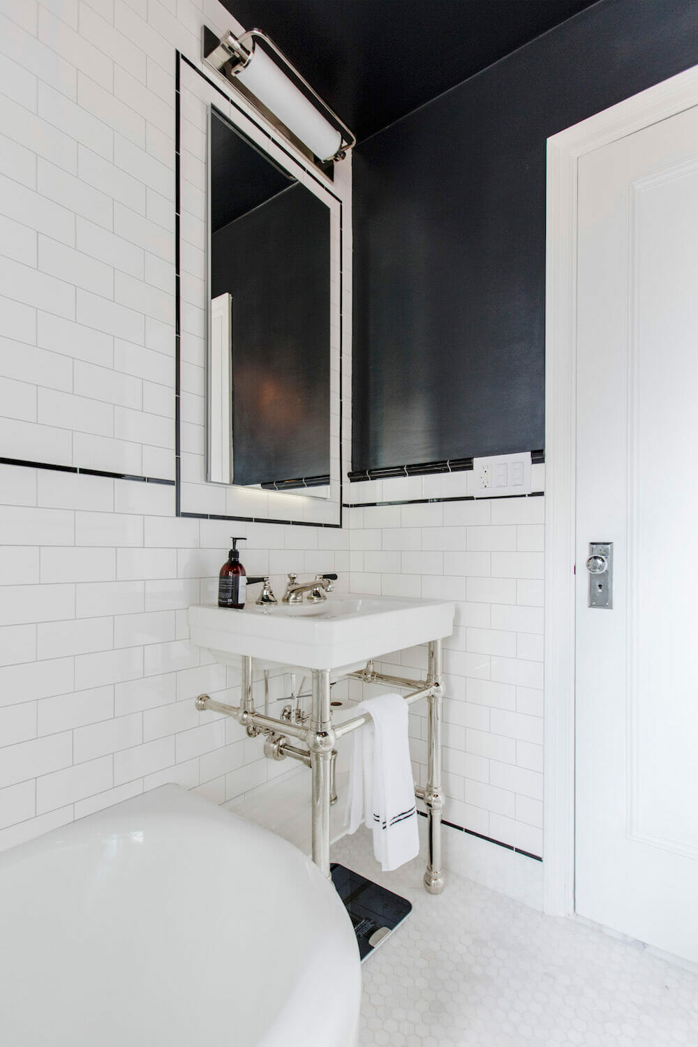 Image of pedestal sink on top of metal console legs