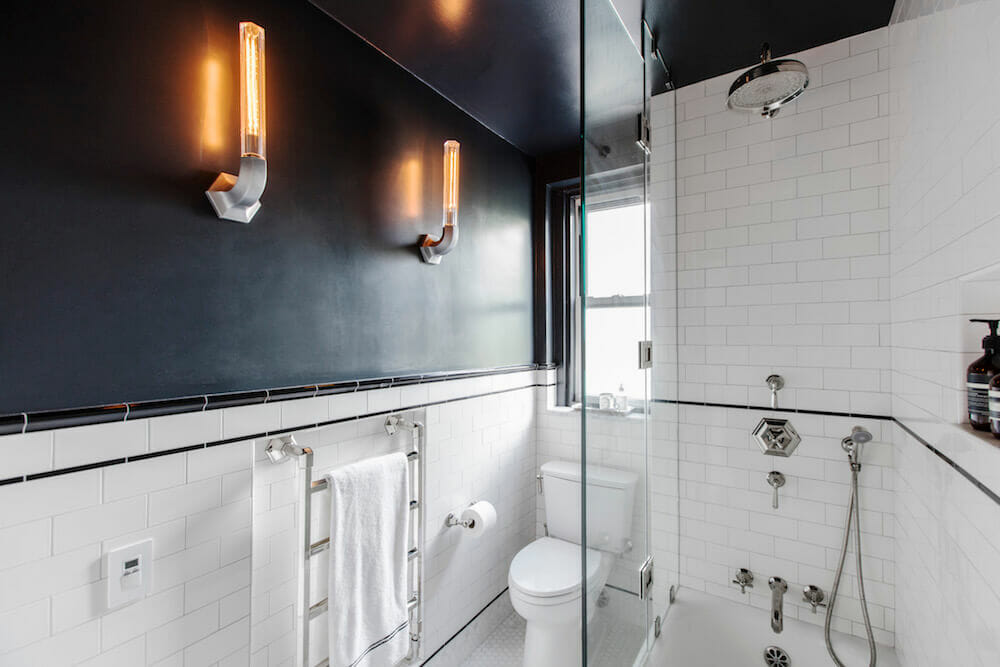 Image of a renovated bathroom with towel warmer and bathtub