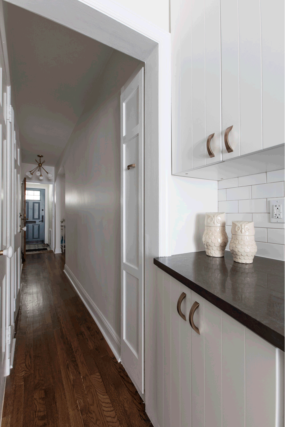 Image of hidden pull-out pantry in renovated kitchen