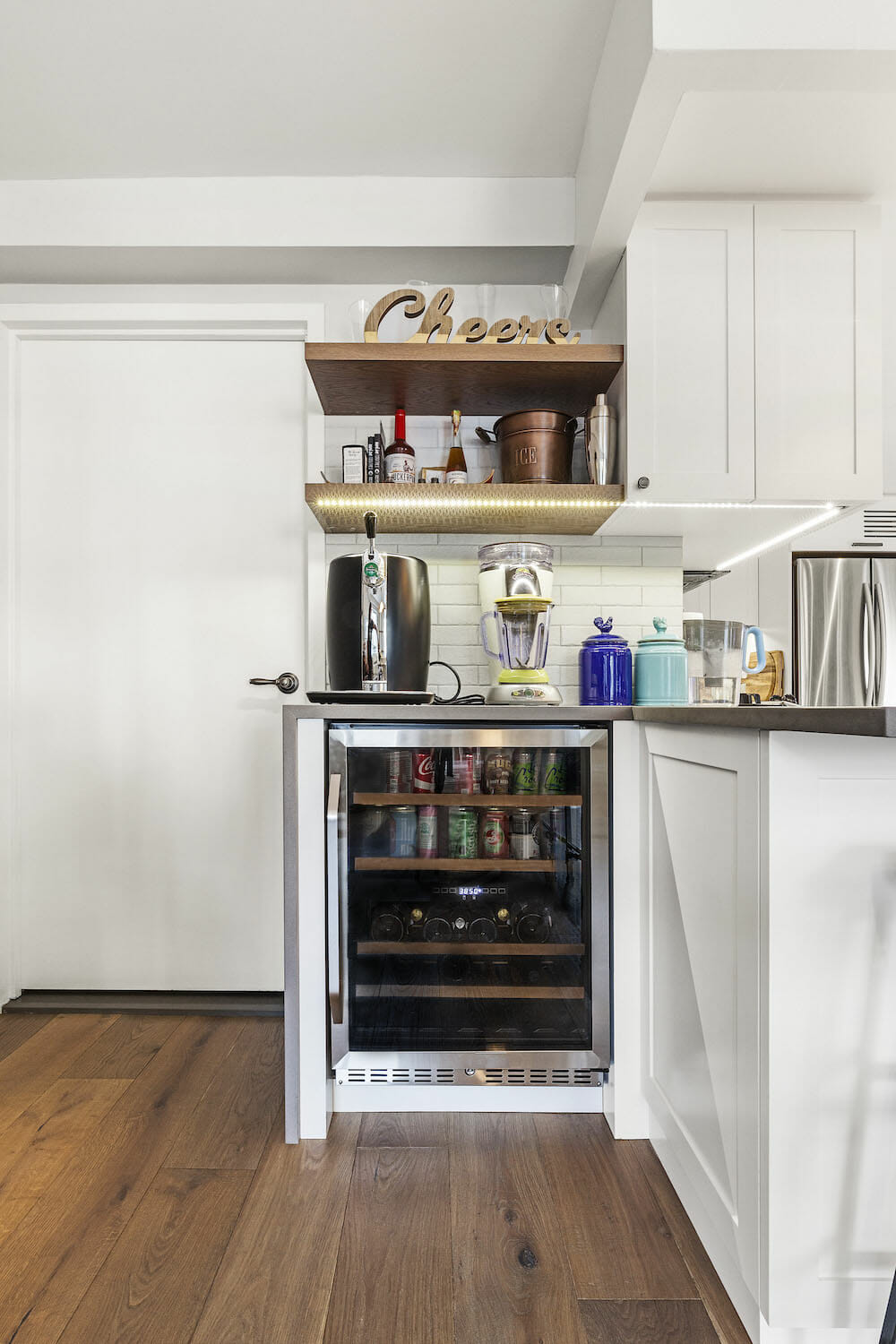 Image of a small wine fridge in kitchen nook