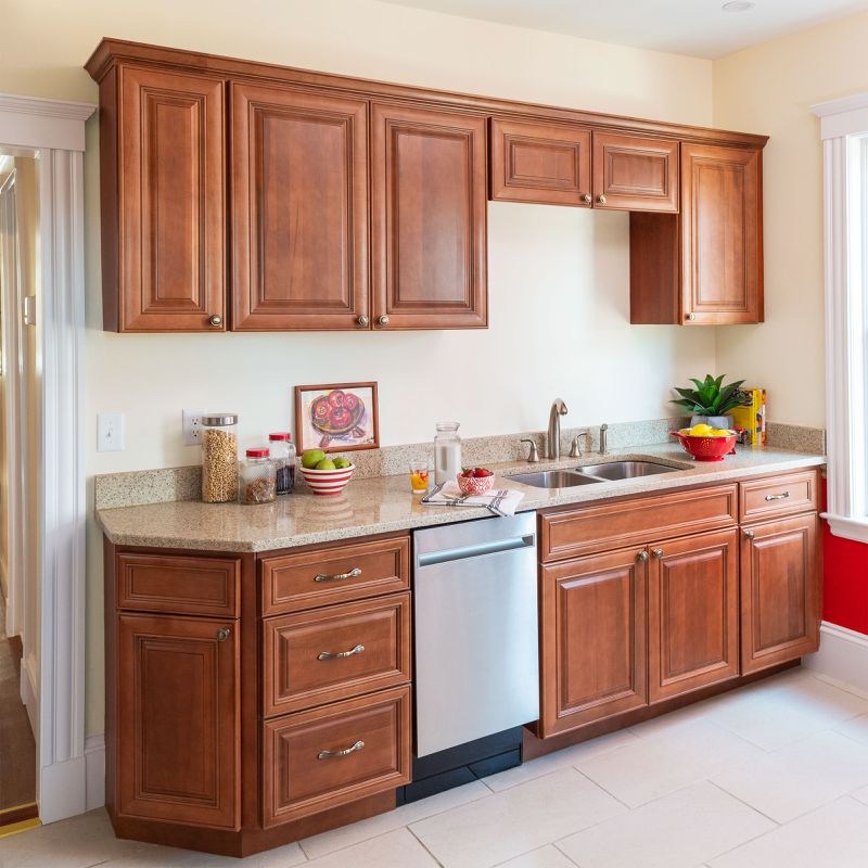 A small kitchen with traditional cabinets.