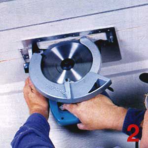 Person cutting a soffit vent with a circular saw.
